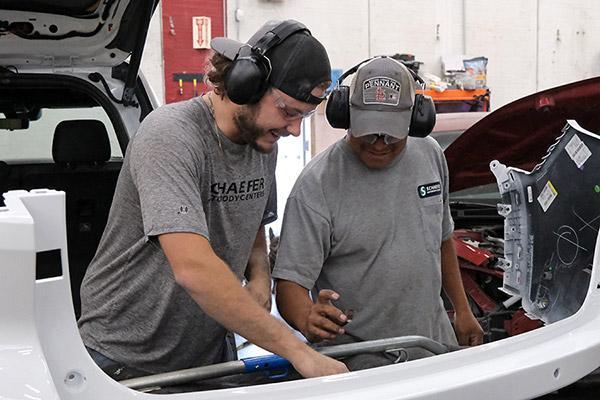 apprentice-works-on-fender | Schaefer Autobody Centers Apprentice works on a fender with journeyman